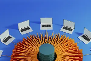 Artificial Intelligence Technology Impressions: Multiple laptops surround a central data hub