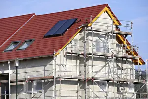 House Building Process Impressions: New building with completed basic rendering of the exterior facade New building with completed basic rendering of