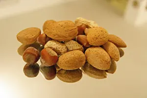 Studio Shot Of Nuts Impressions: Nuts on a mirror