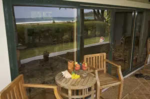 Deserted Beach Scenery Impressions: Oceanfront lanai with reflection of view
