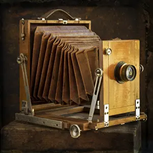 Brown Background Still Life Impressions: Old camera on brown background