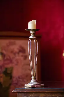 Red Background Image Impressions: Old candlestick in front of red background