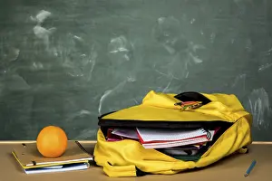 Educational Institution Equipment Impressions: Open backpack orange table
