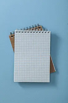 Desk Setup Ideas Impressions: Two Opened Note Pads On Blue Background