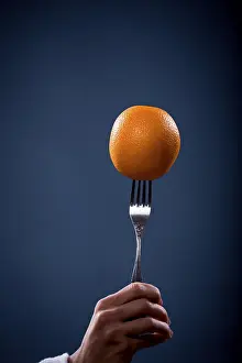 Fresh Healthy Eating Impressions: Orange on a fork