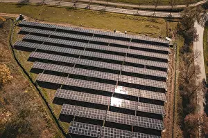 Renewable Energy Solutions Impressions: Overview of solar modules in ordered formation with sunlight