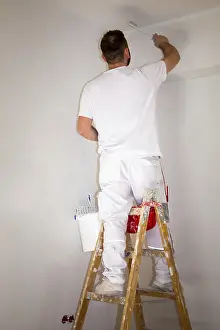 Old Building Restoration Impressions: Painter renovates an old flat