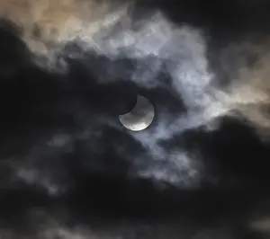 Central European Landmark Impressions: Partial solar eclipse, thin cloud cover