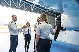 Air Traffic Transport Impressions: Pilot instructor explaining airplane propeller
