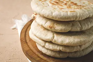 Uninhabited Dining Area Impressions: Pita bread, stack, on the table, no people