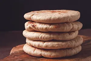 Bakery Products On Table Impressions: Pita bread, stack, on the table, no people