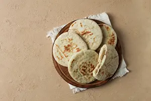 Meal Preparation Ingredients Impressions: Pita bread, stack, on the table, no people