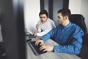 Computer Specialist Impressions: IT Programmer Working on Desktop Computer
