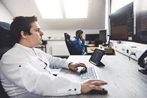 Modern Technology Impressions: IT Programmer Working on Desktop Computer
