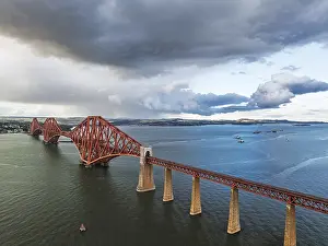 Forth Bridge Scotland Impressions: Rain clouds over Forth Bridge from a drone