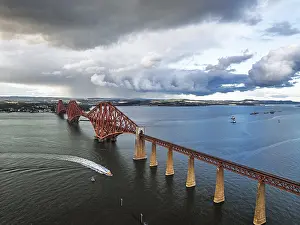 Scottish Tourist Attractions UK Impressions: Rain clouds over Forth Bridge from a drone