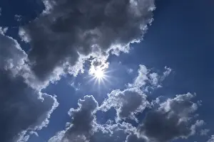 Germany Cloudy Sky Impressions: Rain clouds with sun in backlight