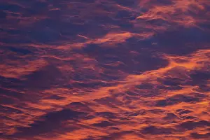 Red Sky Dawn Impressions: Reddish orange cloud structures, dawn