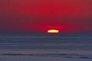 Hazy Evening Sky Impressions: Refraction and reflection at sunset
