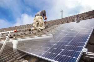 Alternative Energy Source Impressions: Roofer, worker on the rooftop. Roofing work