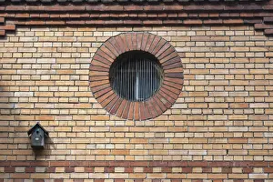 Brick Wall Architecture Impressions: A round window, also called oculus