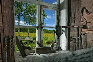 German Countryside View Impressions: Rustic workshop with old tools and view out of the window into the landscape