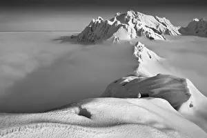 Cloudy Mountain Landscape Impressions: Santis, summit in winter above clouds