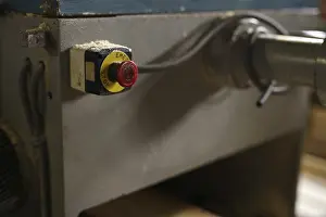 Industrial Building Architecture Impressions: At sawmill. Image of stop button on machine