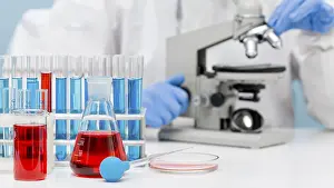 Female Scientist In Lab Impressions: Scientist checking substance with microscope
