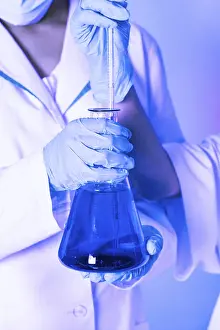 Scientist Experiment Impressions: Scientist shows a diffusion in the flask