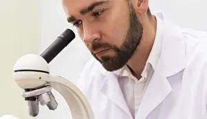 One Person Lab Impressions: Scientist is using microscope in a laboratory during research work