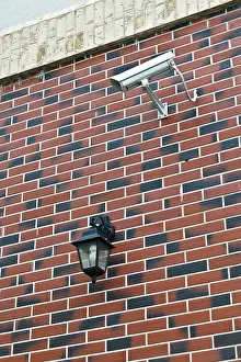 CCTV Camera Installation Impressions: Security camera and flashlight on the wall of the house