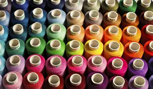 Multicolored Threads Impressions: Sewing threads as a multicolored background close up