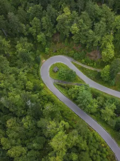 Black Forest Road Impressions: Sharp bend in a road surrounded by dense forest