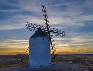 Windmill At Sunset Impressions: Single windmill against a dramatic sunset