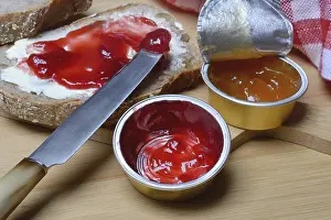 Basic Food Still Life Images Impressions: Slice of bread with jam and jam in portion pack