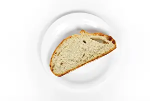 High Angle View Plate Impressions: A slice of bread on a plate