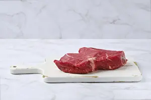 Raw Beef Steak Impressions: Slice of raw top side beef steak