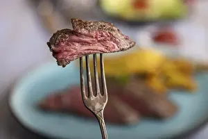 Meat Dish Images Impressions: Slice of steak on a fork
