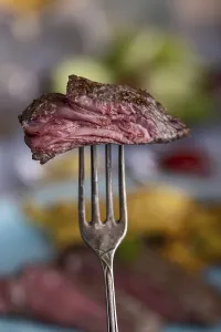 Meat Dish Images Impressions: Slice of steak on a fork