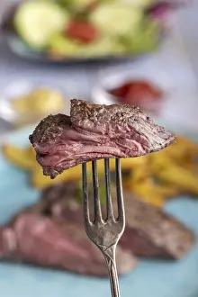 Steak Meal Ideas Impressions: Slice of steak on a fork