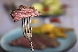 Meat Dish Images Impressions: Slice of steak on a fork