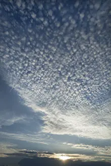 Backlit Cloud Formation Impressions: Small cirrocumulus clouds, herringbone sky