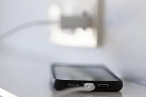 German Power Industry Impressions: A smartphone is charged via a socket
