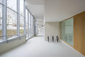 Modern Office Building Interior Impressions: A spacious corridor featuring large