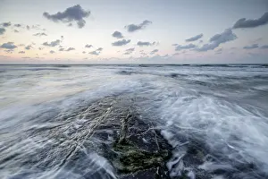 Benelux Countries Scenery Impressions: Splash and waves under a dramatic pink sky