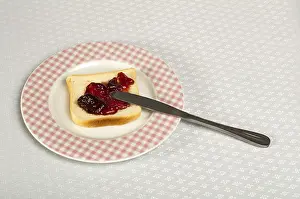 Berry Fruit Nutrition Impressions: Spread jam on bread with knife