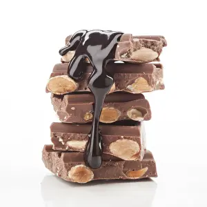 Colorful Candy Impressions: A stack of chocolate bars with almonds