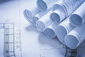 Engineering Blueprint Impressions: Stack of construction plans building and architecture concept