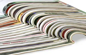 Bright White Background Cutout Impressions: Stack of magazines isolated on white background